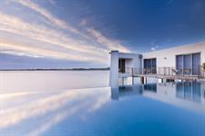 Hotel infinity edge pool blends with sea and sky