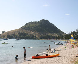Mount Maunganui, (Mauao) is a dormant volcanic cone resting at the end of the town’s peninsula bearing its name