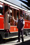 Tram staff helping passenger