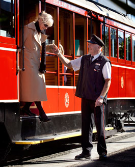 Tram staff helping passenger