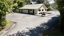 Clean, well-maintained kitchen & bathroom amenities with BBQ & picnic seating,