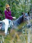 Horseback riding through the bush