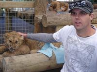 Mark and lion cub at Paradise Valley