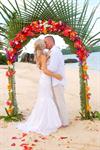 A newly-married couple share a kiss